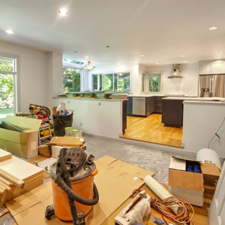 Shelves, circular saw, doors and other remodeling tools and supplies fill the family room as the kitchen is worked on